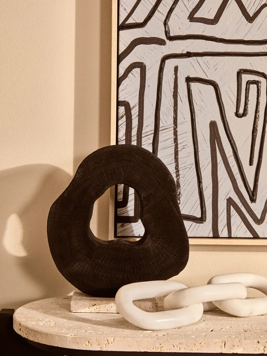 Black Mango Wood Sculpture on Travertine Base